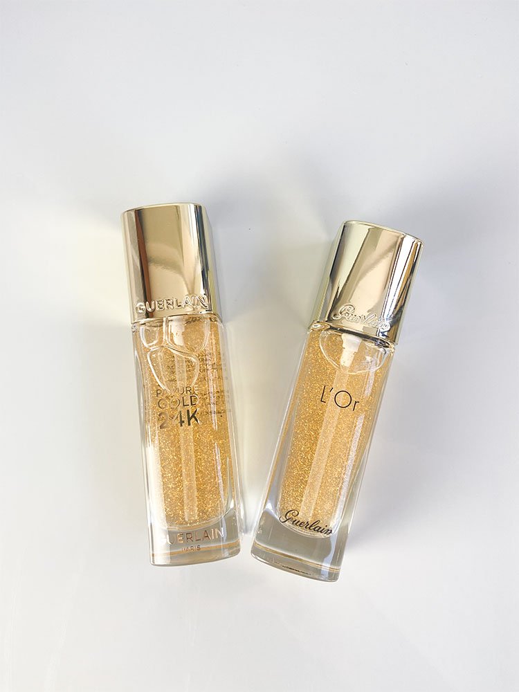 Visão frontal comparando as duas embalagens do Primer Guerlain 24K e sua versão antiga o L'Or